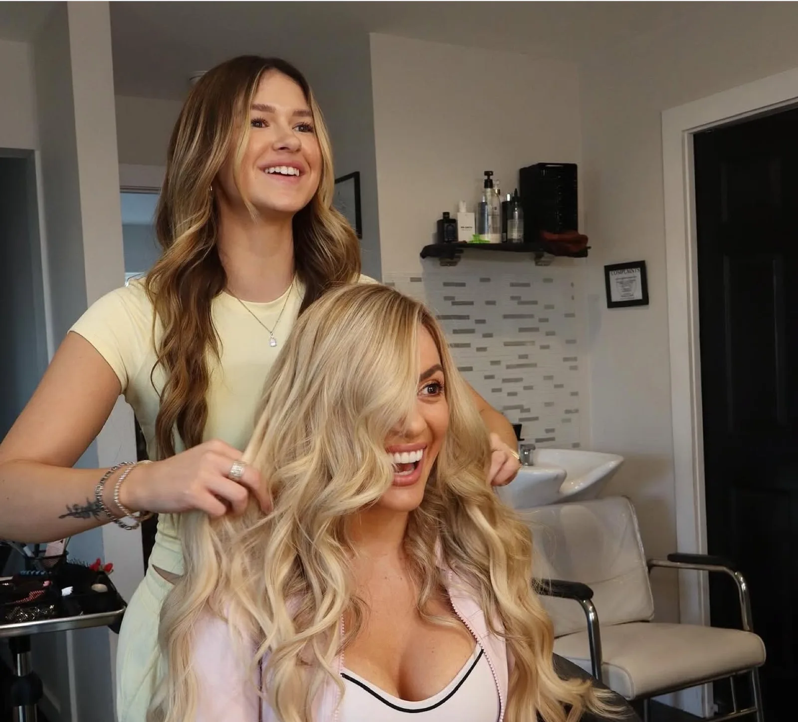 Bloom Salon ATX stylist consulting with a client about extensions